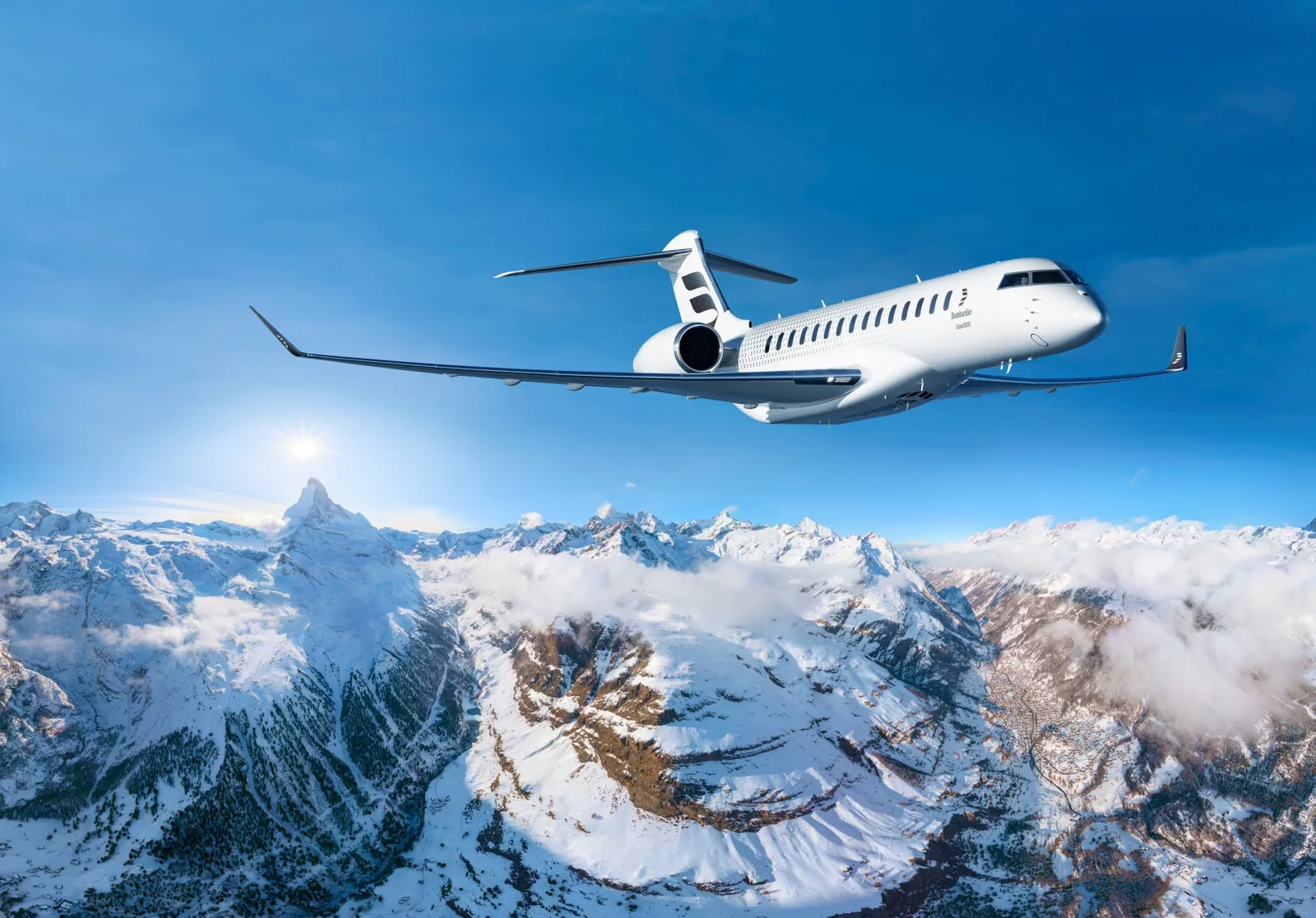 Bombardier Global 8000 in flight above snow-covered Alpine peaks